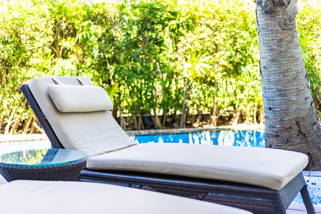 Stylish Empty Chair by Poolside in Hotel Resort – Free Download