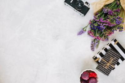 Flowers and Retro Camera Surrounded by Gifts and Macaroons – Free Download