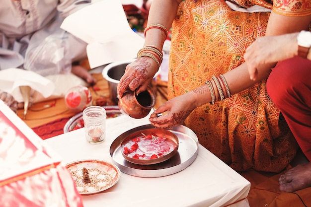 Indian Bride Preparing Nuts with Spices and Petals – Free Download