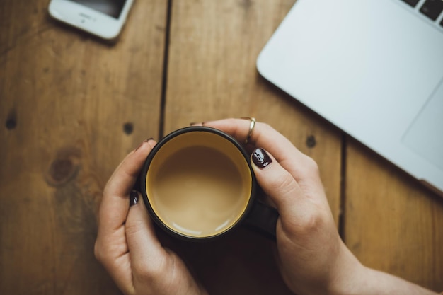 Women Hands with Laptop and Coffee on the Table – Free Download