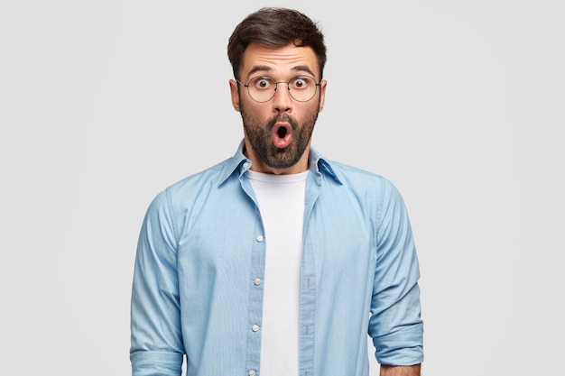 Terrified Unshaven Man in Blue Shirt with Disbelief and Surprise – Free Stock Photo for Download