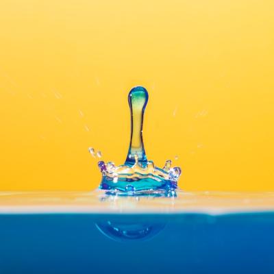 Clear Waterdrop Splashing on Orange – Free Download