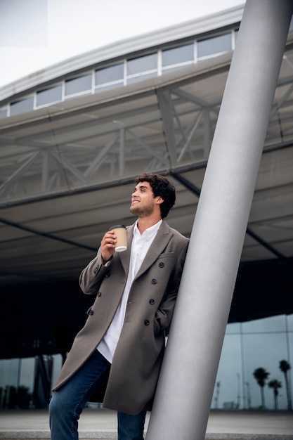 Medium Shot of a Man Enjoying Coffee – Free Download