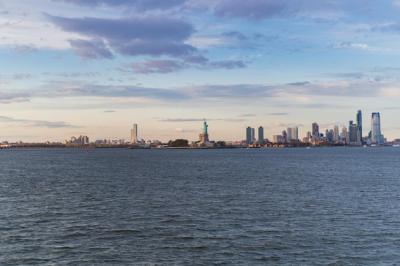 Stunning Sunset View of the Statue of Liberty from the Water – Free Download