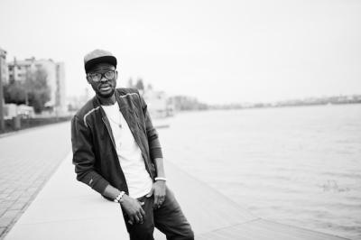 Stylish African American Man in Sportswear Cap and Glasses by the Lake – Free Stock Photo Download