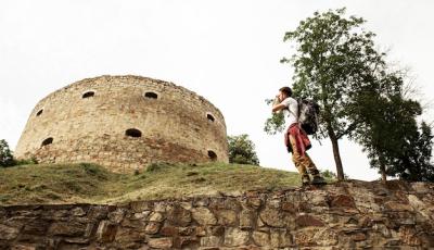 Low Angle Photo of a Man Capturing a Castle – Free Download