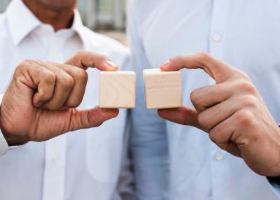 Close-Up of Businessmen Holding Cubes – Free Stock Photo for Download