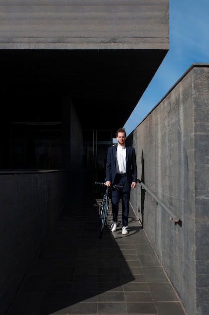 Man in Suit Riding Bicycle to Work – Free Stock Photo for Download