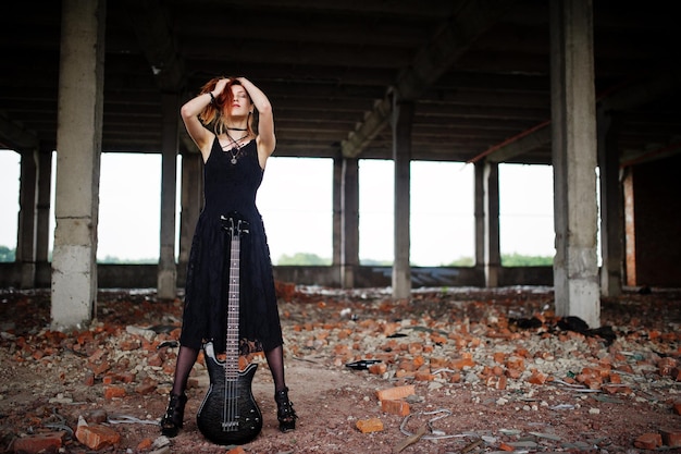 Portrait of a Red-Haired Punk Girl with a Bass Guitar in an Abandoned Place – Free Stock Photo Download