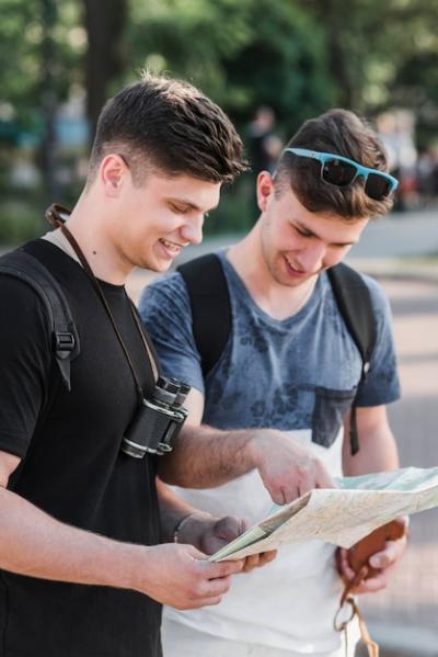 Men Exploring City Map on the Street – Free Stock Photo for Download