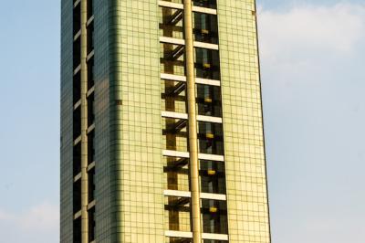 Tall and Colorful Skyscrapers Against a Beautiful Blue Sky – Download Free Stock Photo