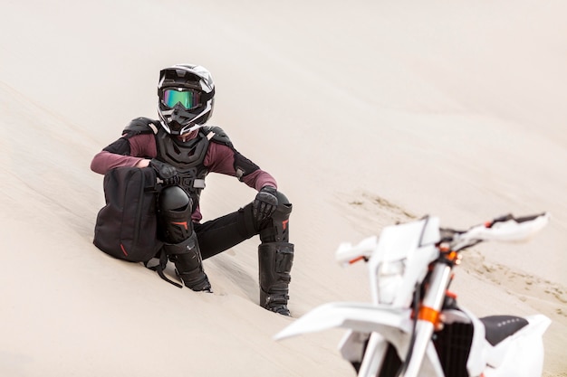 Motorbike Rider Relaxing in the Desert – Free Download