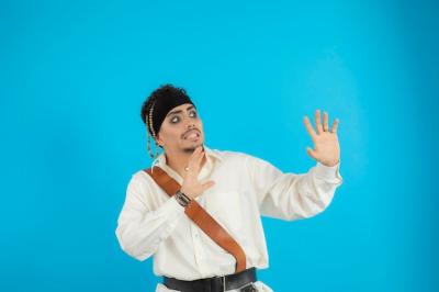 Young Pirate Looking Aside on Blue Background – Free Stock Photo Download