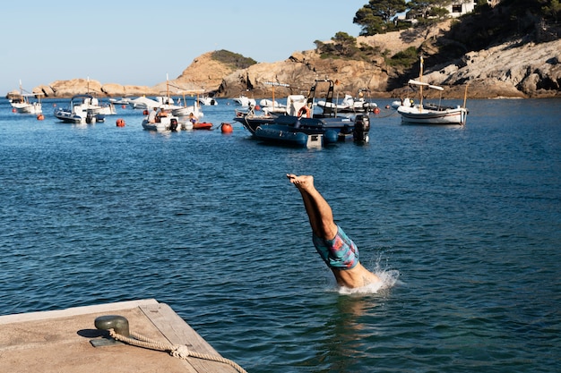 Dynamic Close-Up of a Man Jumping in Water – Free Download