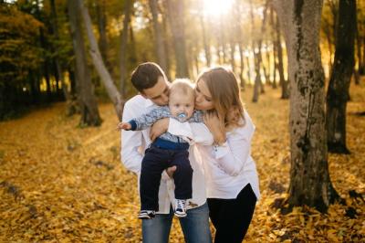 A Young Couple Walking in the Woods with a Little Boy – Free Download