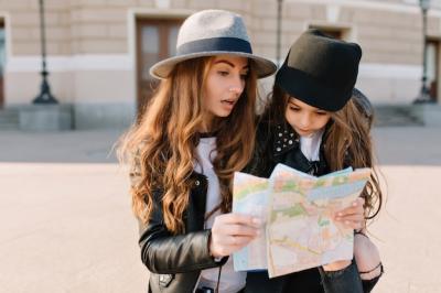 Gorgeous Long-Haired Woman Examining Map with Confused Expression – Free Download