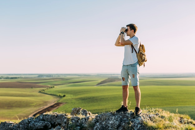 Man Observing Through Binoculars – Free Stock Photo, Download Free