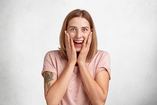 Amazed Beautiful Young Female with Stunned Expression – Free Stock Photo for Download