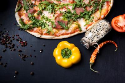 Spices and Delicious Italian Pizza on Black Concrete Background – Free Download