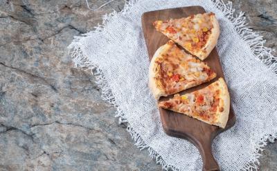 Delicious Pizza Slices with Melted Cheese on Wooden Board – Free Stock Photo for Download