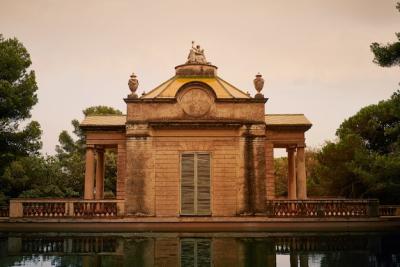 Old Beautiful Park Building Reflecting in a Pond – Free Download