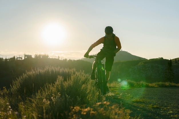 Young Adult Riding Electric Bike in the Countryside – Free Download