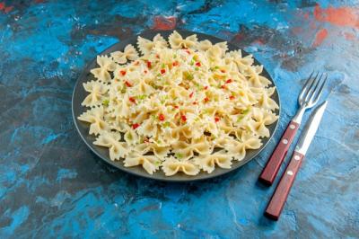 Raw Italian Farfalle Pasta with Vegetables on Blue Background – Free Stock Photo for Download