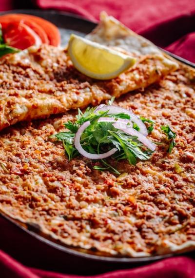 Lahmacun with Meat Stuffing, Chopped Onion, Parsley, Tomato, and Lemon – Free Stock Photo Download