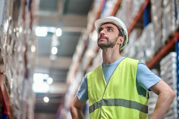 Man in Overalls Looking Up – Free Stock Photo for Download