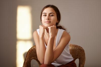 Charming Indoor Portrait of a Tanned Young European Woman – Free to Download