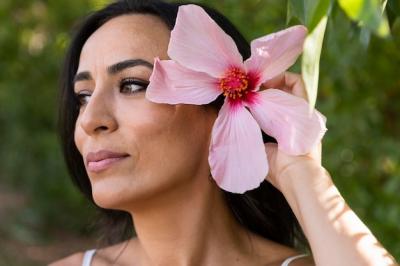 Beautiful Woman Outdoors with Flower in Hair – Free Stock Photo for Download