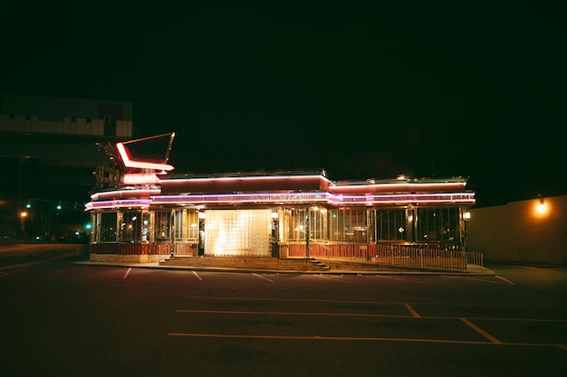 Lit Store in the City at Night – Download Free Stock Photo