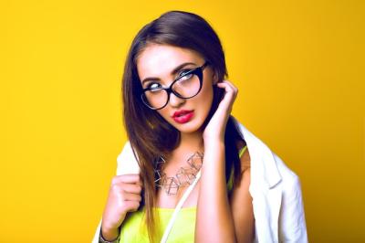 Portrait of a Sensual Young Woman with Long Brunette Hair and Retro Glasses – Free Download