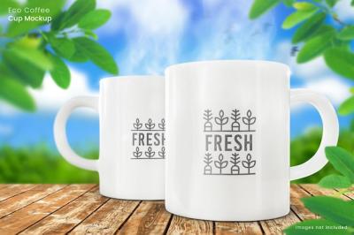 Two 11oz White Ceramic Mug Mockups on Wooden Table in Outdoor Nature Setting – Free Download