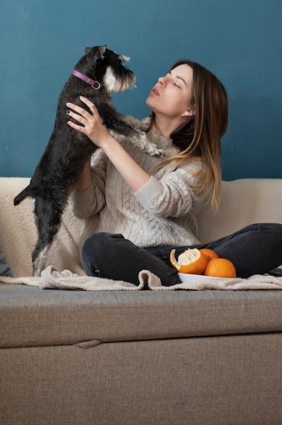 Joyful Moments: Woman Playing with Her Dog – Free Stock Photo for Download