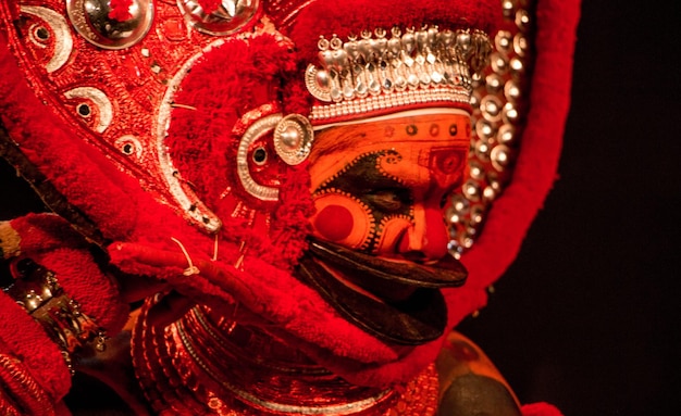 Close-up of Theyyam Dancer Against Black Background – Free Stock Photo for Download