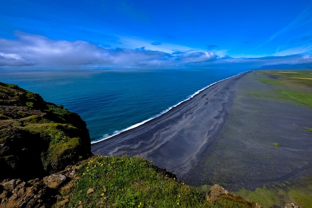 Aerial View of Shoreline by Mountains Under Clear Blue Sky – Free Download