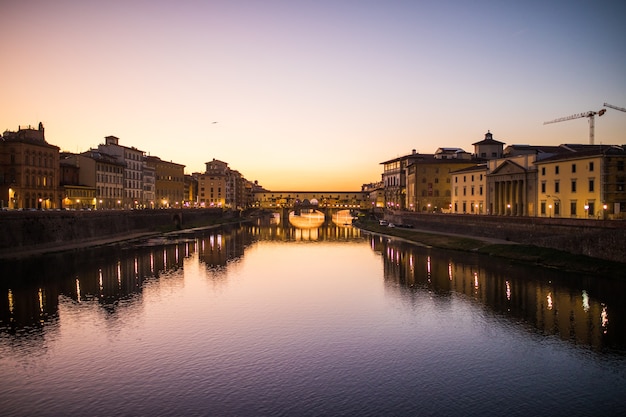 Stunning Sunset Over Ponte Vecchio and River Arno in Florence, Italy – Free Download