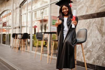 Young Female African American Student with Diploma Poses Outdoors – Free Stock Photo, Download for Free