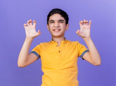 Playful Young Caucasian Boy Making Tiger Roar Gesture – Free Stock Photo for Download