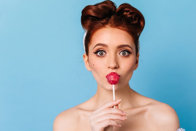 Charming Caucasian Girl Licking Lollipop – Free Stock Photo for Download