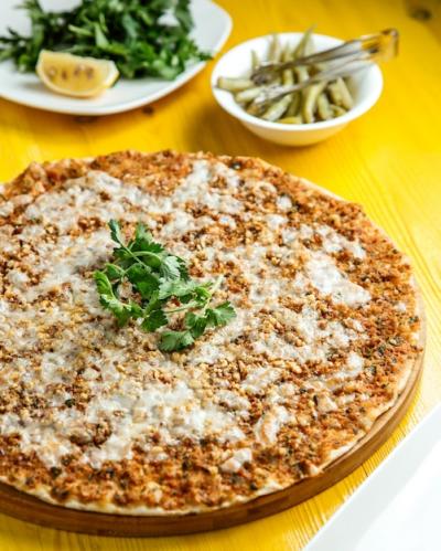 Traditional Turkish Cuisine Lahmacun with Minced Meat, Cheese, and Lemon – Free Download