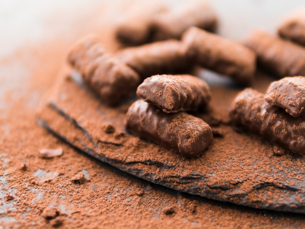 Chocolate Sticks Coated in Cocoa on Slate Plate – Free Stock Photo for Download