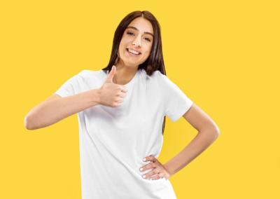 Beautiful Female Portrait Smiling on Yellow Background – Free Download