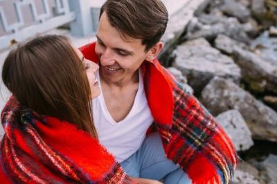 Beautiful Young Couple on a Stone Embankment – Free Stock Photo for Download