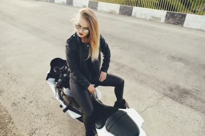 Biker Girl in Leather Clothing on a Motorcycle – Free Download