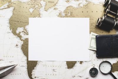 Travel Items on Blank Paper with World Map Background – Free Stock Photo for Download