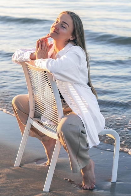 Beautiful Woman Sitting by the Sea – Free Stock Photo, Download for Free