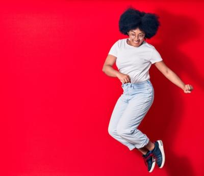 Young Beautiful African American Woman Celebrating with a Smile – Download Free Stock Photo