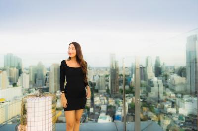 Beautiful Young Asian Woman at Rooftop Bar and Restaurant – Free Stock Photo Download